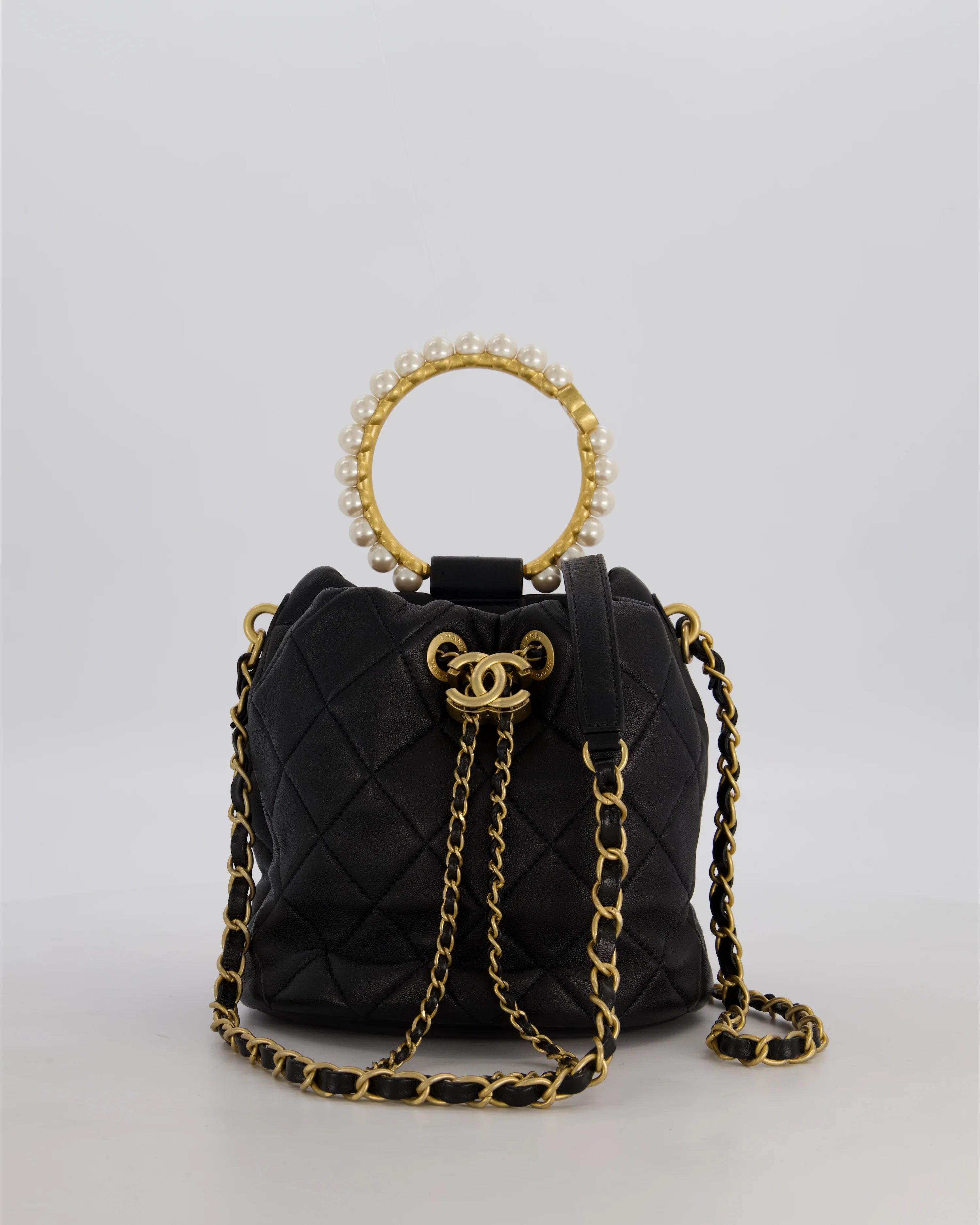 Chanel 2021 Black Quilted Lambskin Imitation Pearl Handle Bucket Bag with Champagne Gold Hardware